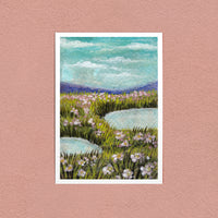 Flower Meadow in Pink art print — pink wildflowers and still pools under a cloudy sky, on a pink wall