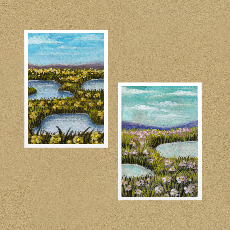 Flower Meadow Set of 2 art prints — the orange and pink meadows shown together on a tan wall