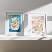 Konbini Snacks set of 2 art prints in white frames on a sunlit shelf (mock-up)