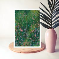 Flower Patch print from the Monet Set, beside a pink vase and a palm leaf (mock-up)