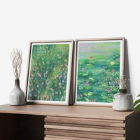 Monet Set of 2 art prints in timber frames on a sideboard beside small vases (mock-up)