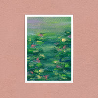 Monet's Lilies art print — pink and gold water lilies on a green pond, shown on a pink wall
