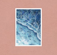 Shoreline art print — foam running thin over pale shallows, seen from above